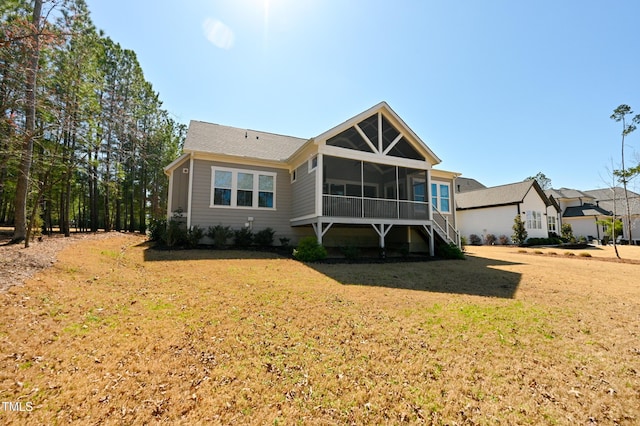 14 Duck Bill Trl, Pittsboro, NC 27312 - rear view of house with a sunroom and a lawn