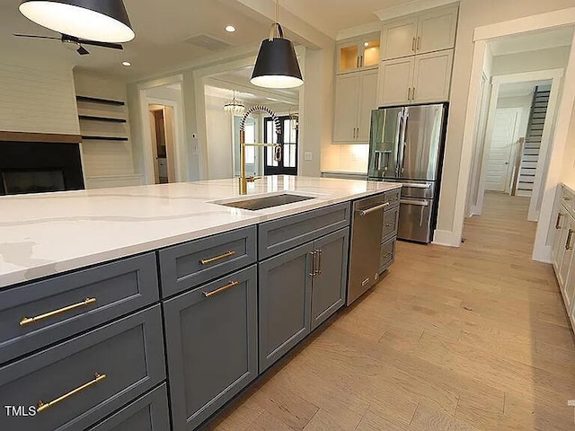 14 Duck Bill Trl, Pittsboro, NC 27312 - kitchen with appliances with stainless steel finishes, a sink, pendant lighting, gray cabinets, and recessed lighting