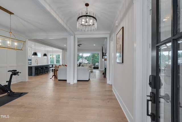14 Duck Bill Trl, Pittsboro, NC 27312 - foyer with a chandelier, light wood-style floors, crown molding, and baseboards
