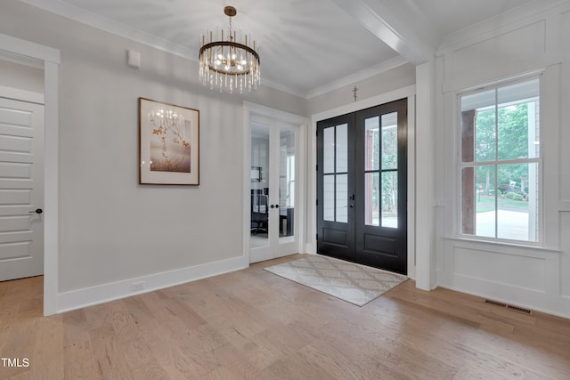 14 Duck Bill Trl, Pittsboro, NC 27312 - entryway featuring french doors, a chandelier, light wood-type flooring, crown molding, and baseboards