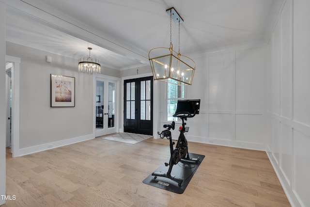 14 Duck Bill Trl, Pittsboro, NC 27312 - workout room featuring a chandelier, french doors, a decorative wall, crown molding, and light wood-type flooring