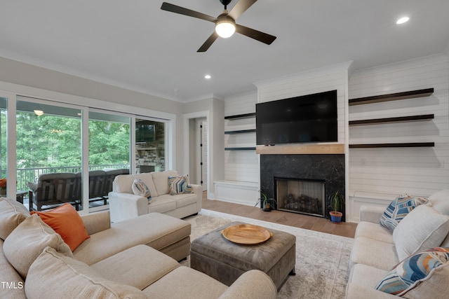 14 Duck Bill Trl, Pittsboro, NC 27312 - living area featuring a ceiling fan, wood finished floors, a high end fireplace, ornamental molding, and recessed lighting