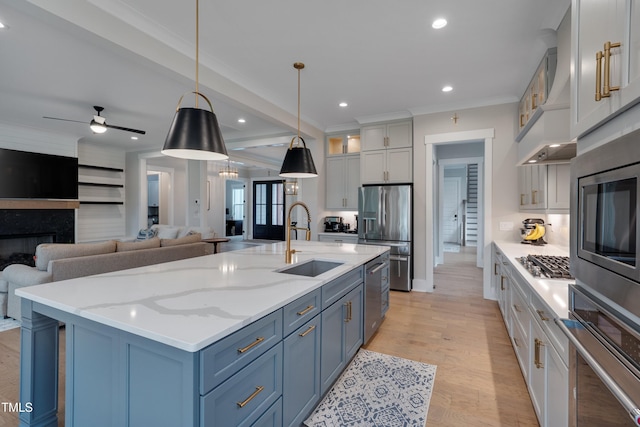 14 Duck Bill Trl, Pittsboro, NC 27312 - kitchen featuring appliances with stainless steel finishes, a sink, wall chimney exhaust hood, glass insert cabinets, and recessed lighting