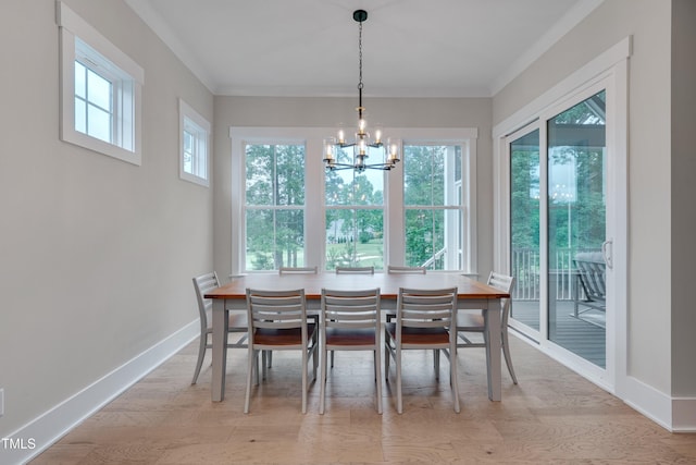 14 Duck Bill Trl, Pittsboro, NC 27312 - dining area featuring a chandelier, wood finished floors, baseboards, and crown molding