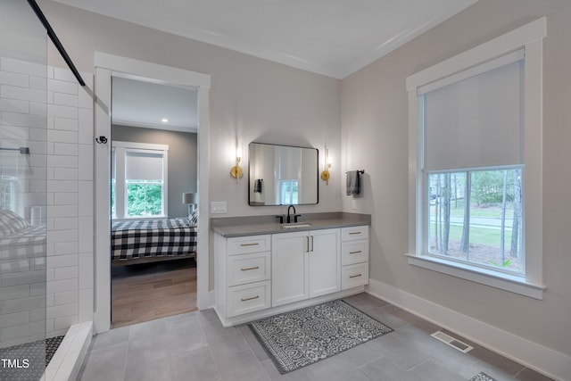 14 Duck Bill Trl, Pittsboro, NC 27312 - ensuite bathroom with vanity, a tile shower, baseboards, tile patterned flooring, and recessed lighting