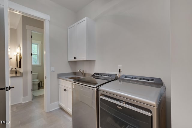 14 Duck Bill Trl, Pittsboro, NC 27312 - laundry area with separate washer and dryer, cabinet space, and baseboards