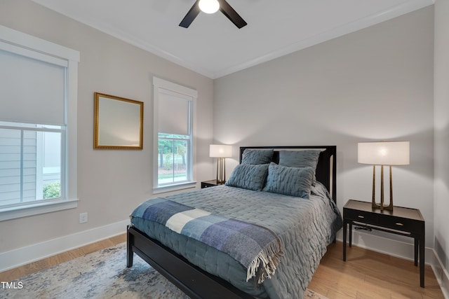 14 Duck Bill Trl, Pittsboro, NC 27312 - bedroom featuring multiple windows, baseboards, wood finished floors, and ornamental molding