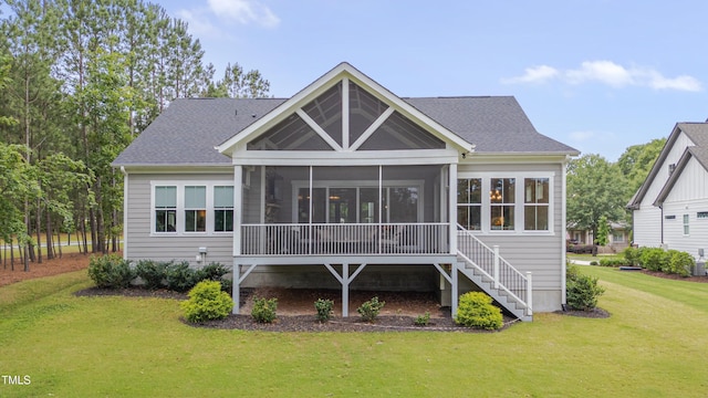 14 Duck Bill Trl, Pittsboro, NC 27312 - rear view of property with a sunroom, a lawn, roof with shingles, and stairway
