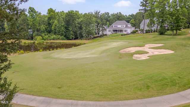 14 Duck Bill Trl, Pittsboro, NC 27312 - surrounding community with golf course view, a water view, and view of wooded area
