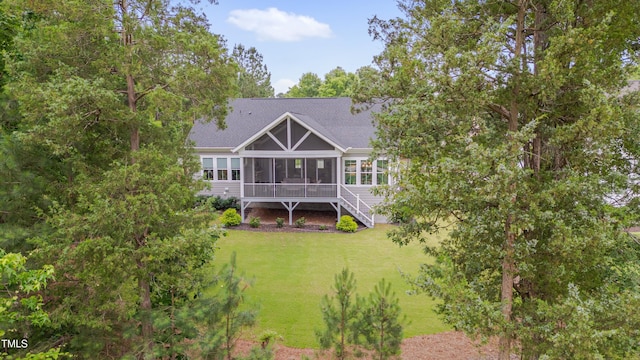 14 Duck Bill Trl, Pittsboro, NC 27312 - back of house with a sunroom, a yard, roof with shingles, and stairs