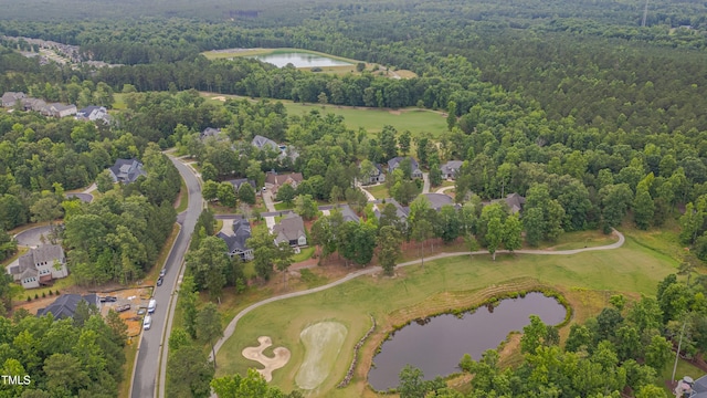 14 Duck Bill Trl, Pittsboro, NC 27312 - aerial view of property's location featuring a large body of water, a heavily wooded area, and nearby suburban area