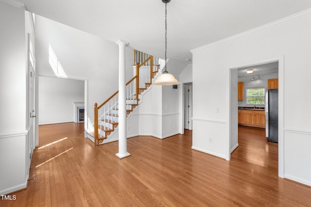 1308 Aspen Falls Ct, Willow Springs, NC 27592 - unfurnished dining area featuring stairs, baseboards, wood finished floors, and a fireplace