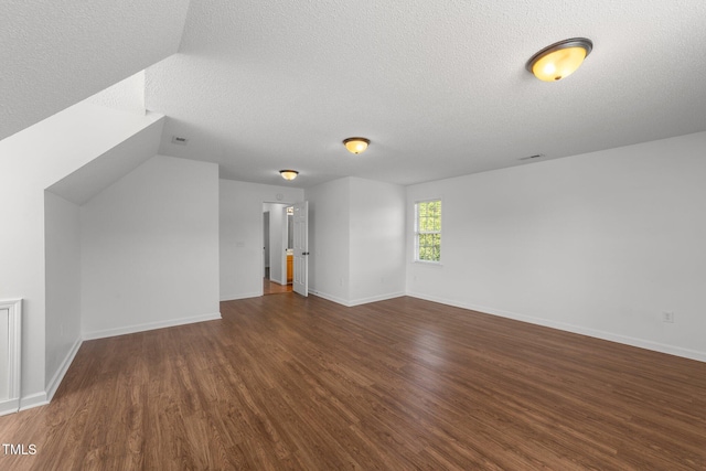 1308 Aspen Falls Ct, Willow Springs, NC 27592 - bonus room featuring a textured ceiling, baseboards, and wood finished floors