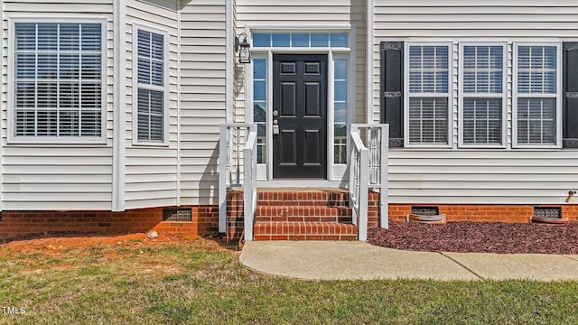 1308 Aspen Falls Ct, Willow Springs, NC 27592 - view of exterior entry featuring a lawn and crawl space
