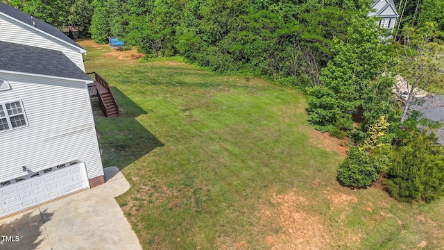 1308 Aspen Falls Ct, Willow Springs, NC 27592 - view of yard featuring an attached garage