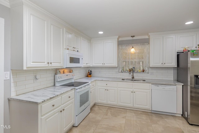 4610 Pinehurst Dr N, Wilson, NC 27896 - kitchen with white appliances, a sink, white cabinets, backsplash, and light stone countertops