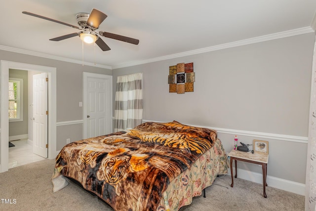 4610 Pinehurst Dr N, Wilson, NC 27896 - bedroom featuring light colored carpet, ornamental molding, ceiling fan, baseboards, and connected bathroom