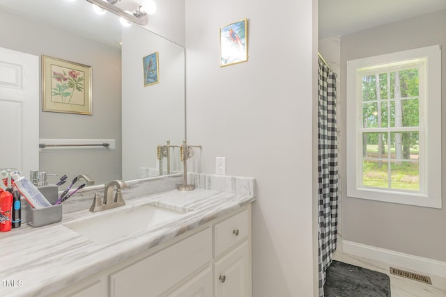 4610 Pinehurst Dr N, Wilson, NC 27896 - bathroom with vanity, baseboards, and a shower with curtain