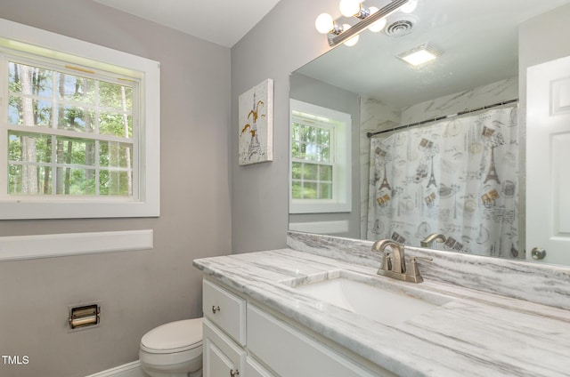 4610 Pinehurst Dr N, Wilson, NC 27896 - bathroom with vanity, toilet, and a shower with shower curtain