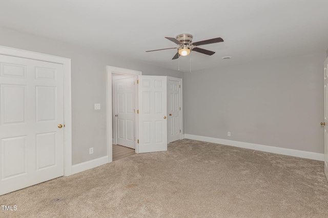4610 Pinehurst Dr N, Wilson, NC 27896 - unfurnished bedroom with carpet, baseboards, and a ceiling fan