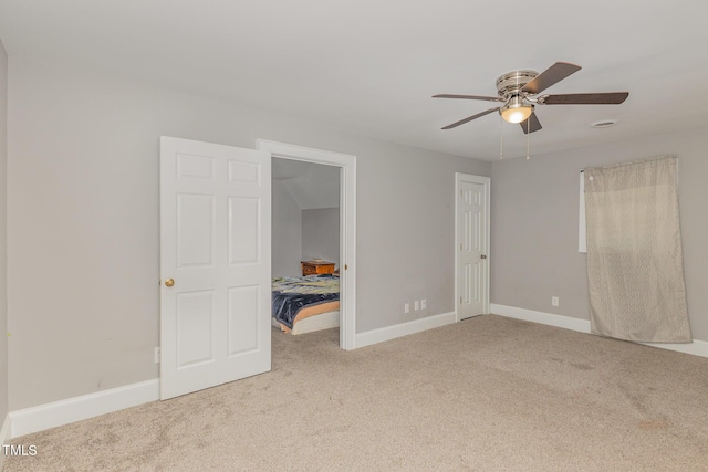 4610 Pinehurst Dr N, Wilson, NC 27896 - unfurnished bedroom with carpet flooring, baseboards, and ceiling fan