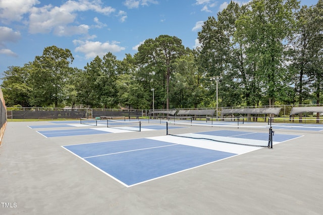4610 Pinehurst Dr N, Wilson, NC 27896 - view of tennis court featuring community basketball court and view of wooded area