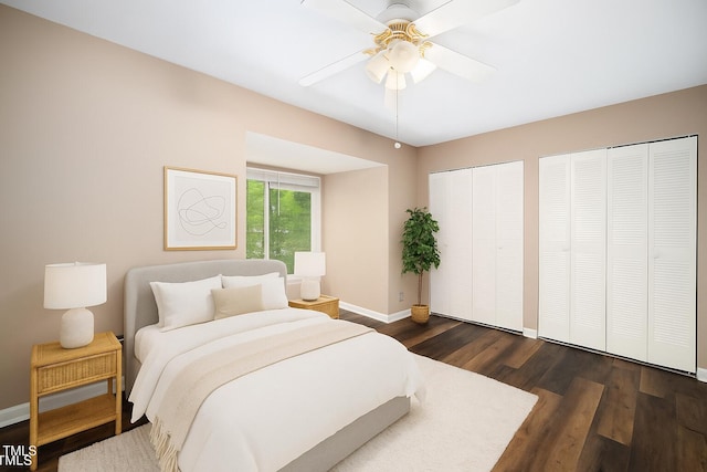 13 Patriot Cir, Durham, NC 27704 - bedroom with multiple closets, dark wood-style floors, and ceiling fan