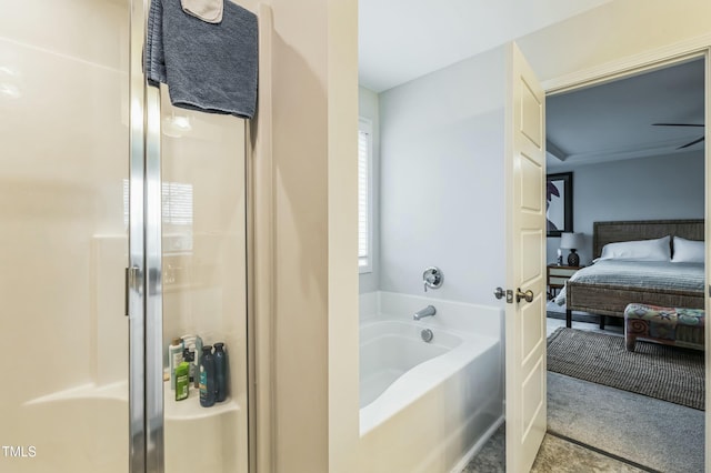 bathroom featuring ensuite bathroom, a garden tub, and a stall shower