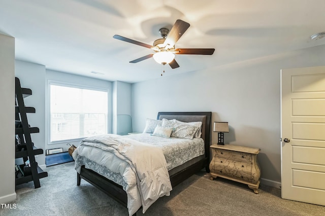 carpeted bedroom with baseboards, visible vents, and ceiling fan