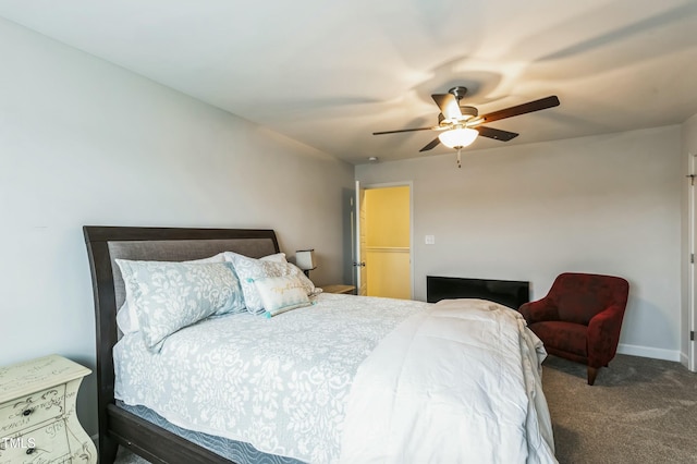 bedroom featuring a ceiling fan, carpet floors, and baseboards