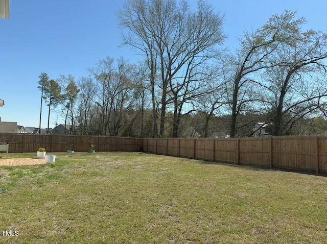 view of yard with a fenced backyard