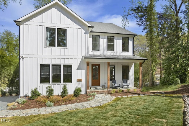 1200 Roosevelt Dr, Chapel Hill, NC 27514 - modern farmhouse style home with a porch, roof with shingles, board and batten siding, and a front yard