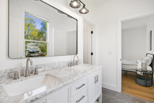 1200 Roosevelt Dr, Chapel Hill, NC 27514 - full bathroom featuring double vanity, baseboards, and a sink