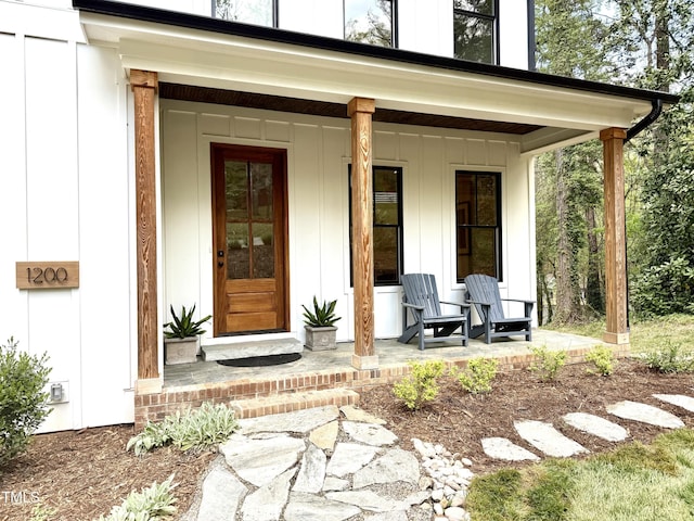 1200 Roosevelt Dr, Chapel Hill, NC 27514 - property entrance with board and batten siding and covered porch