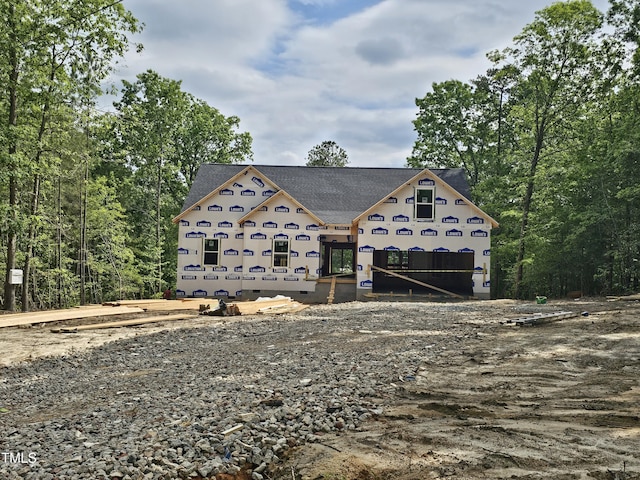 property under construction with roof with shingles