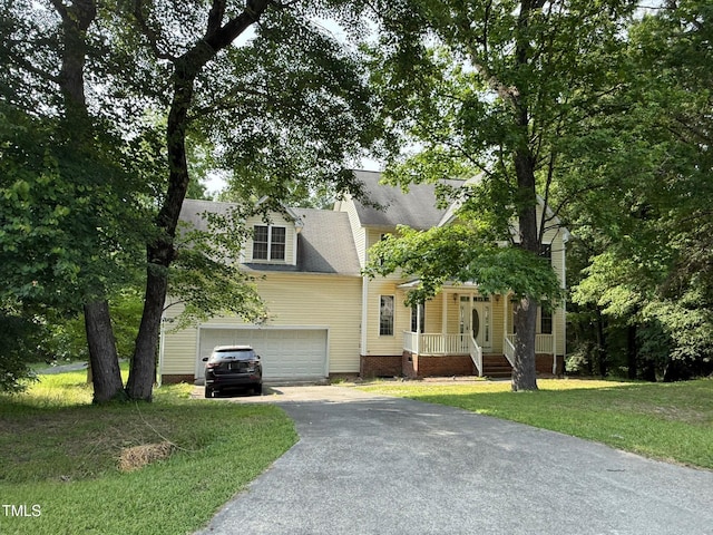 1623 Rogers Pointe Ln, Creedmoor, NC 27522 - view of front of home with asphalt driveway, a front lawn, and a garage