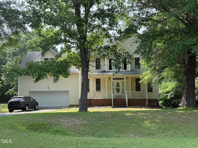 1623 Rogers Pointe Ln, Creedmoor, NC 27522 - view of front of home featuring a porch, a front yard, and driveway