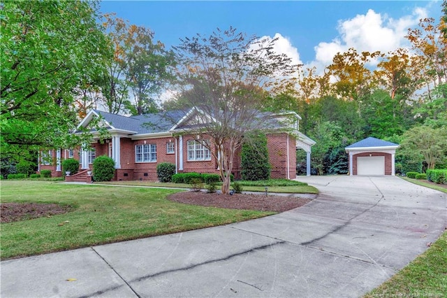 view of front of house with concrete driveway, crawl space, a front yard, brick siding, and an outdoor structure