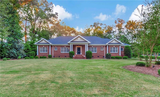 view of front of home with brick siding, a front lawn, and crawl space