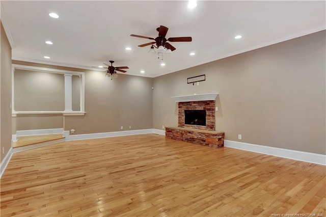 unfurnished living room with light wood-style flooring, ornamental molding, and ceiling fan