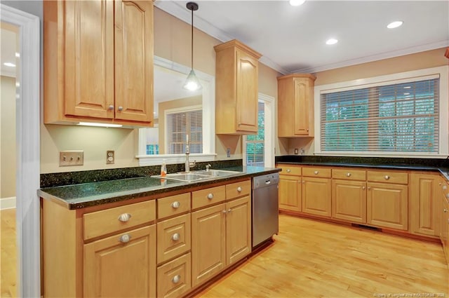 kitchen featuring dishwasher, a sink, crown molding, and light wood-type flooring