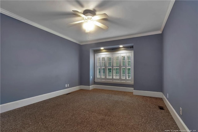 unfurnished room featuring a ceiling fan, baseboards, visible vents, ornamental molding, and carpet