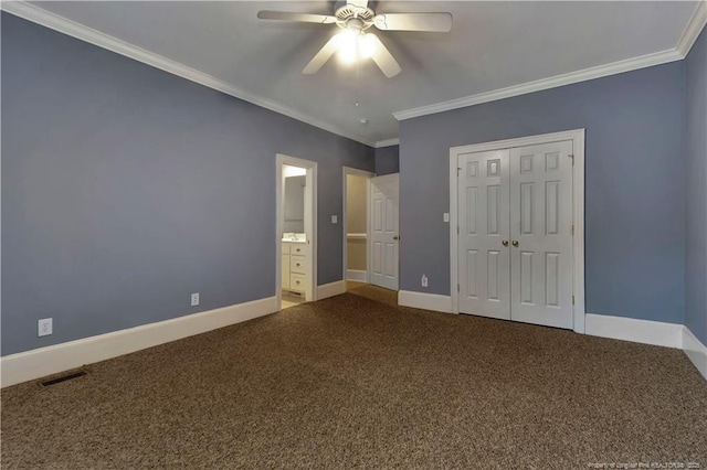 unfurnished bedroom with ornamental molding, carpet, baseboards, and visible vents