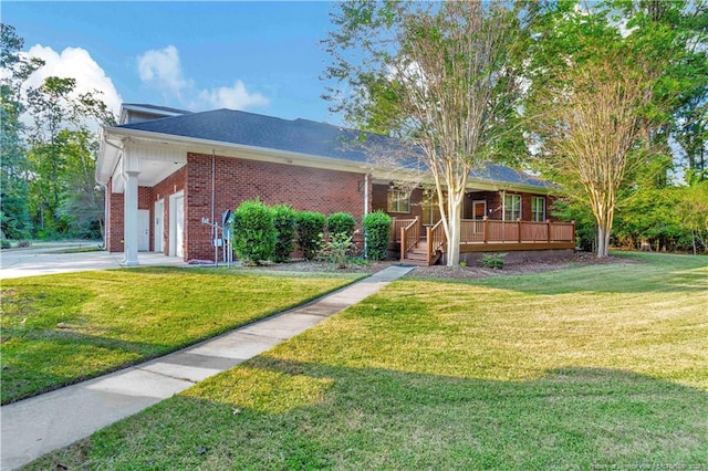 single story home featuring brick siding, a front yard, driveway, and a garage
