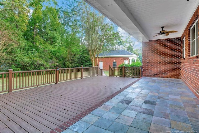 wooden deck featuring ceiling fan