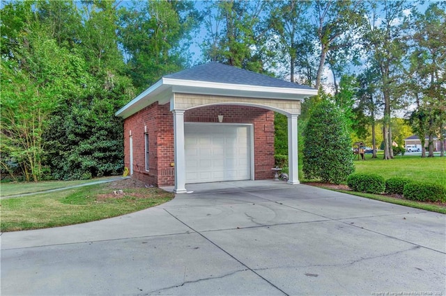 garage with concrete driveway