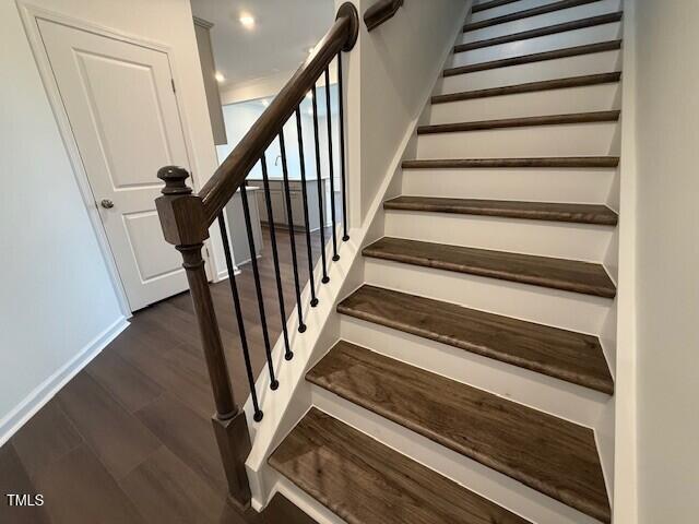 237 Shingle Oak Rd, Wake Forest, NC 27587 - stairs featuring wood finished floors and baseboards