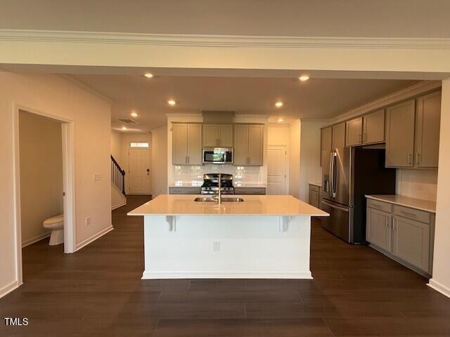 237 Shingle Oak Rd, Wake Forest, NC 27587 - kitchen with appliances with stainless steel finishes, gray cabinets, light countertops, recessed lighting, and tasteful backsplash