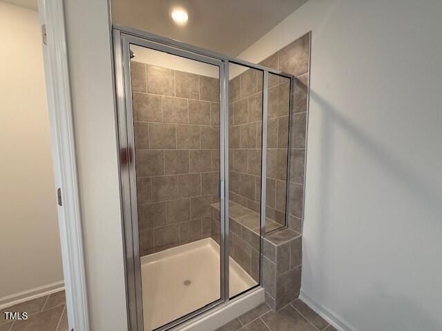 237 Shingle Oak Rd, Wake Forest, NC 27587 - full bathroom featuring tile patterned flooring and a stall shower