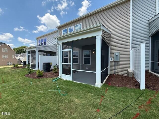 237 Shingle Oak Rd, Wake Forest, NC 27587 - back of property featuring a sunroom and a lawn